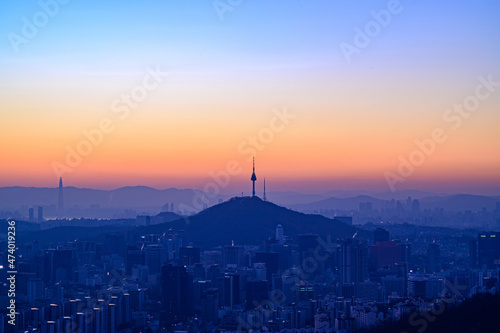 City scape night view of Seoul,Korea at sunrise time from the top of mountain © SEUNGJIN