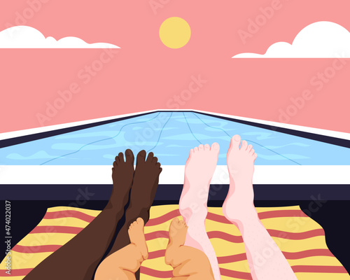 Feet of interracial family relaxing at the pool
