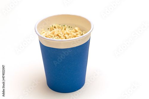 Instant Noodles in Blue Cup on White Background. Asian Fast Food. Quick Lunch