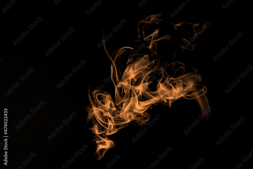 Abstract orange flame, smoke on black background. Photography of ...