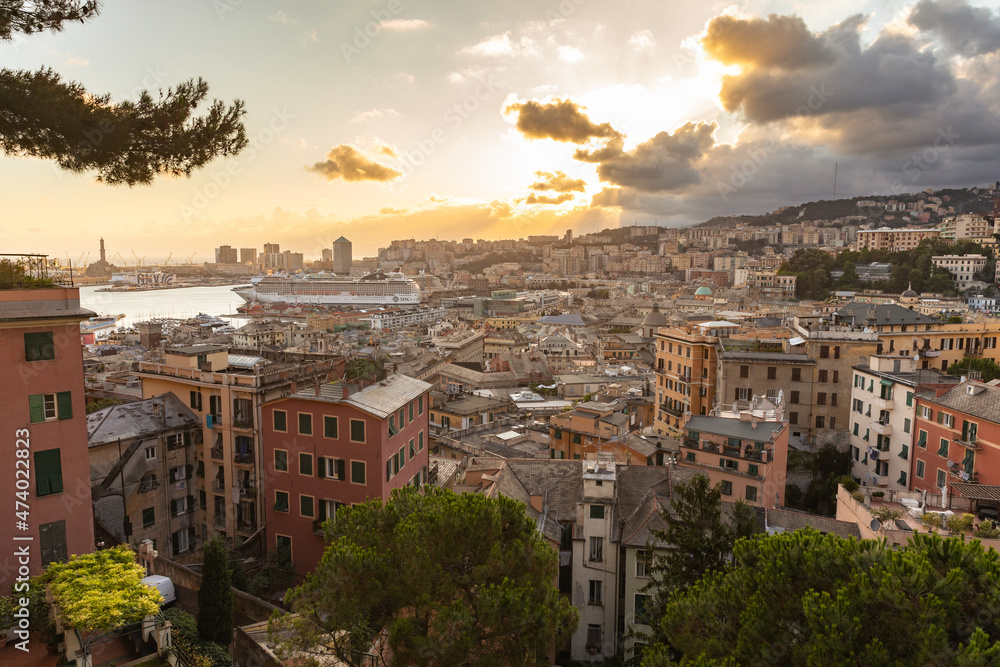 Panoramic view of port of Genoa with Porto Antico, boats and the colorful houses on italian coastline