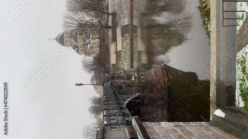 Zverynas Bridge and Church of Our Lady of the Sign in winter. Vilnius, Lithuania. Vertical  photo