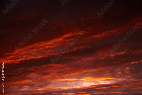 Red sunset sky with dramatic clouds © mikeosphoto