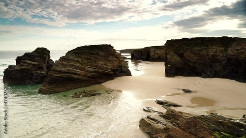 Timelapse of ocean at low tide. Playa las Catedrales, Catedrais beach in Ribadeo, province of Lugo, Galicia. Cantabric sea coast landscape in northern Spain.