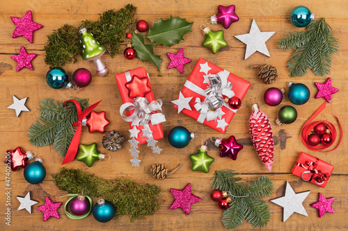 Collection of Christmas themed items flat laid on wooden surface