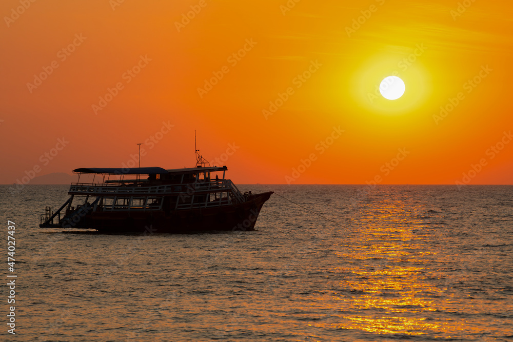 PATTAYA, THAILAND The sun is red and round, beautiful. Beach in Pattaya Bay