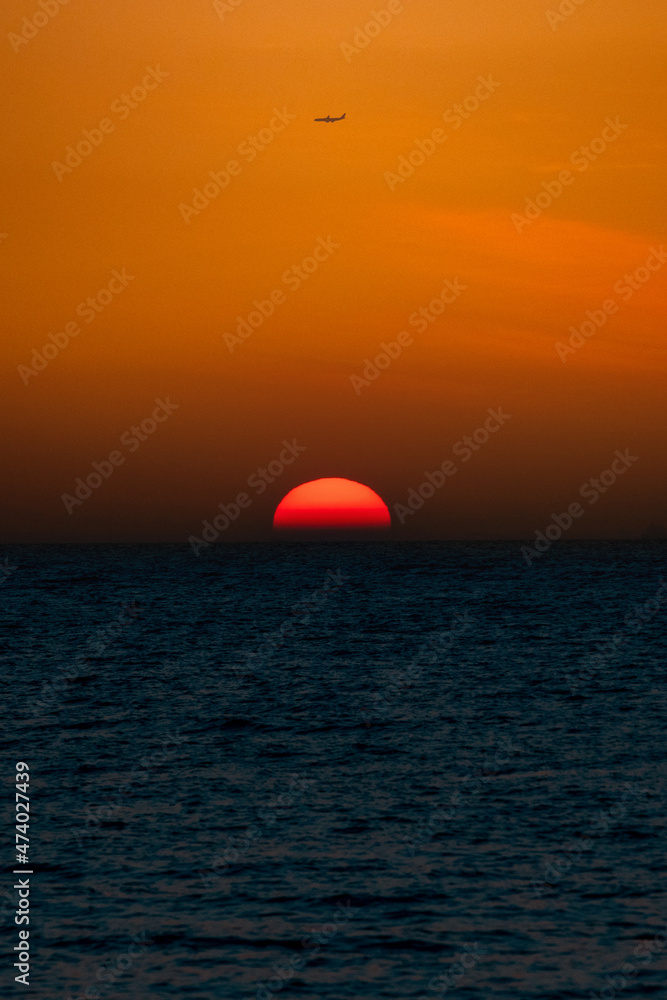 PATTAYA, THAILAND The sun is red and round, beautiful. Beach in Pattaya Bay PATTAYA, THAILAND The sun is red and round, beautiful. Beach in Pattaya Bay