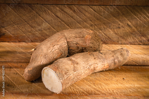 Raw Cassava Starch - Manihot esculenta. Wooden background