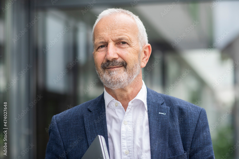 Smiling male professional with white hair and beard Smiling male professional with white hair and beard
