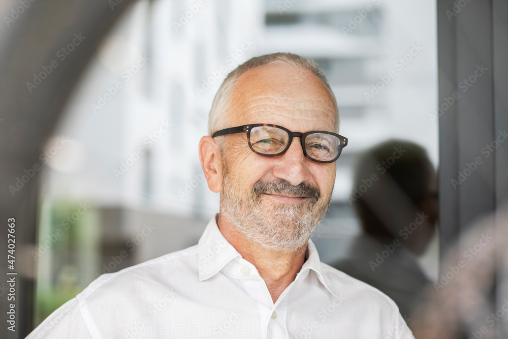 Smiling businessman wearing eyeglasses Smiling businessman wearing eyeglasses
