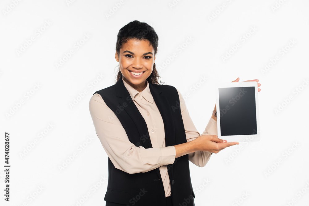 Positive african american businesswoman holding digital tablet with blank screen isolated on white. Positive african american businesswoman holding digital tablet with blank screen isolated on white.