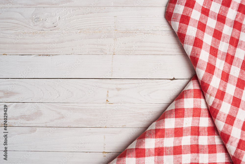 Obraz premium Red checkered tablecloth wooden background texture kitchen decoration