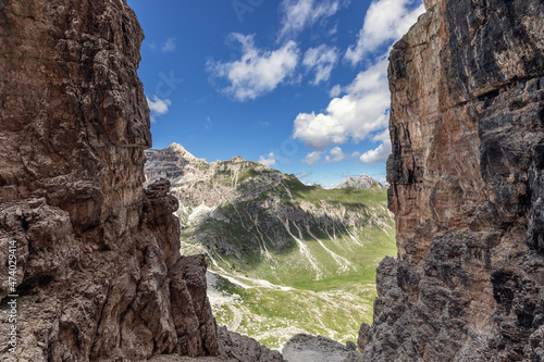 Pass through the cliffs of the Dolomites Alps. Summer, beautiful sunny day