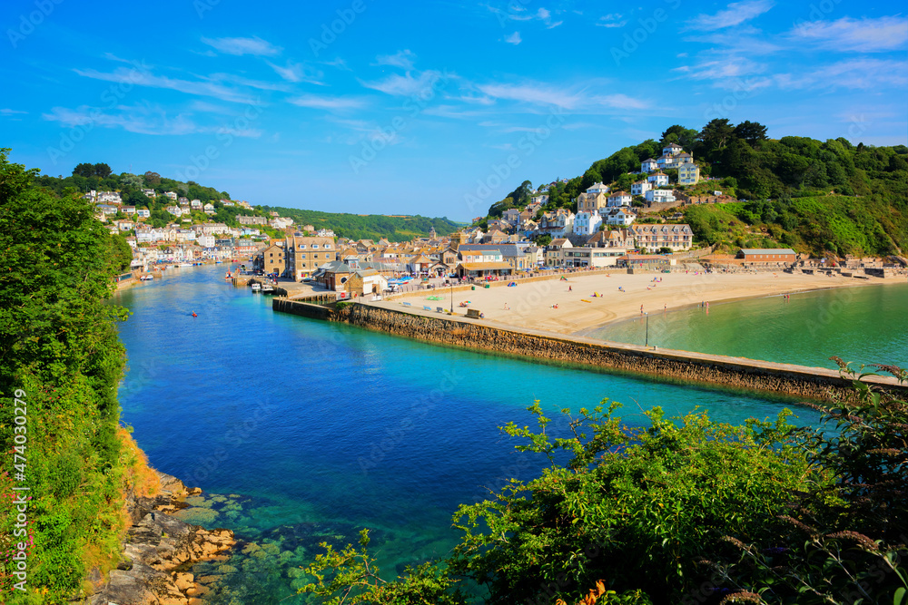 Looe Cornwall town and beach and harbour with beautiful blue sea and sky south west UK