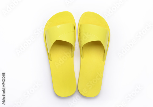 Yellow slippers on a white background. 