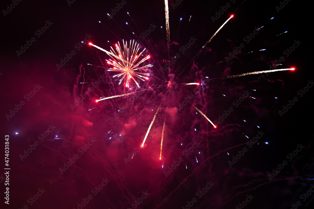Obraz premium Fireworks at New Year. Abstract holiday background.