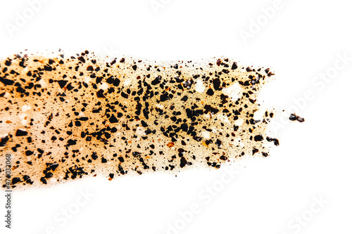 Coffee transparent scrub smear on white isolated background. Beauty concept texture. Body lotion flat lay, top view.