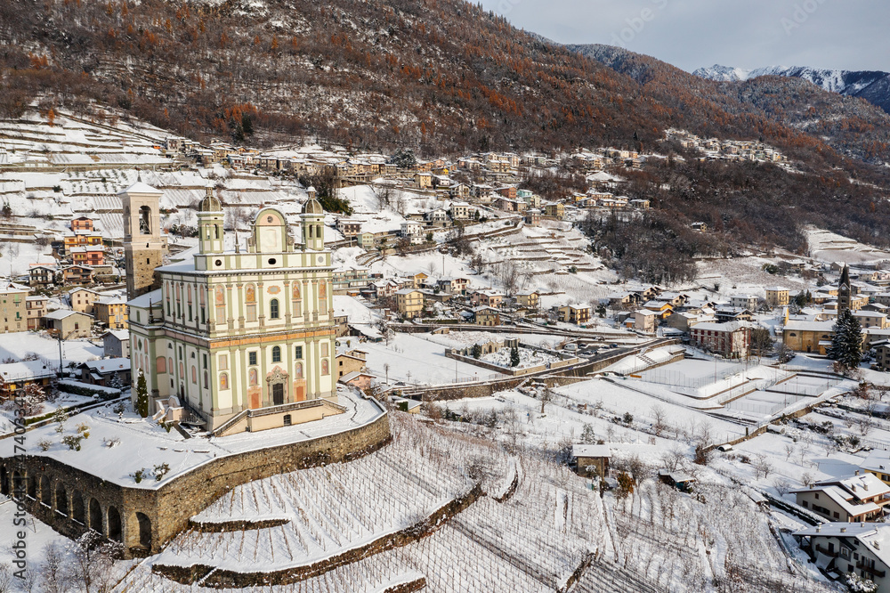 Fototapeta premium aerial view of the village of Tresivio in Valtellina, Italy, Church of Santa Maria di Loreto