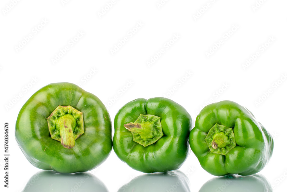 Three sweet green peppers, close-up, isolated on white. Three sweet green peppers, close-up, isolated on white.