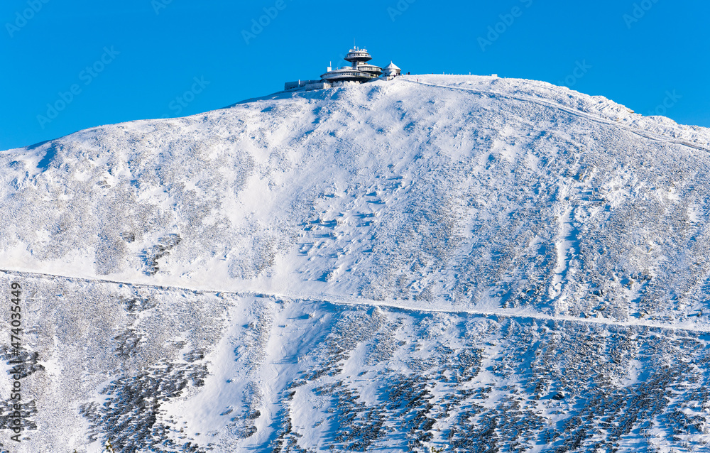 view on Sniezka peak during winter sunny day in Poland and czech republic border