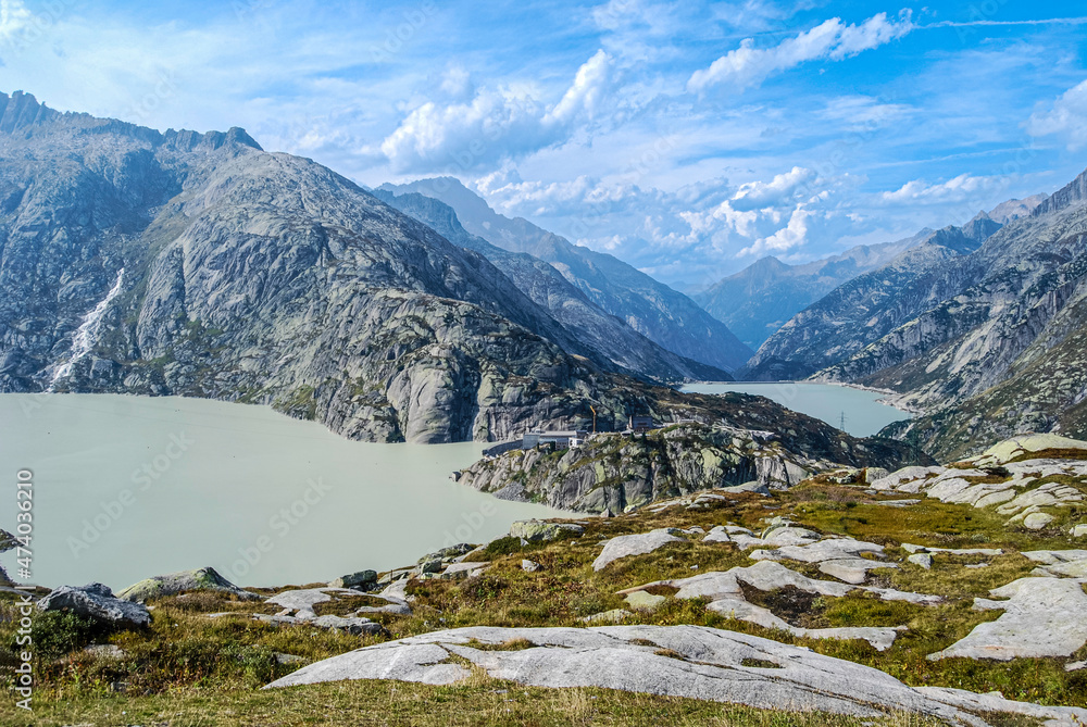 Reservoirs on the Grimsel Pass in Switzerland. The Grimsel Pass connects the Swiss cantons of Bern and Wallis and is a watershed between the North Sea and the Mediterranean See Reservoirs on the Grimsel Pass in Switzerland. The Grimsel Pass connects the Swiss cantons of Bern and Wallis and is a watershed between the North Sea and the Mediterranean See