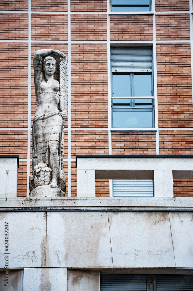 Obraz premium Detail of The building for homes and offices overlooking Via della Posta and Piazza degli Affari designed by Emilio Lancia in 1939