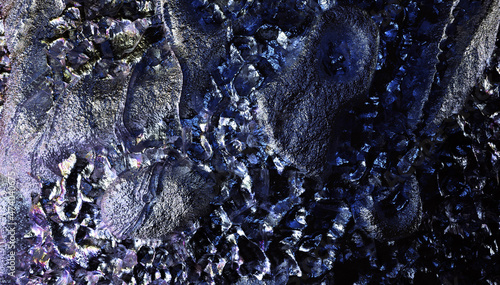 3d render of abstract art 3d background texture with part of rough grunge planet asteroid surface with damages scratches cranks and crater holes in metal iron material in blue violet color