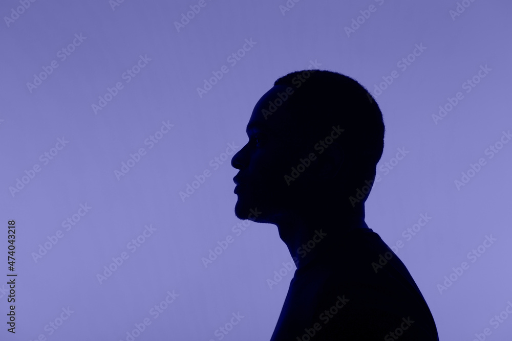 Man silhouette pose on very peri colour of 2022 background Man silhouette pose on very peri colour of 2022 background