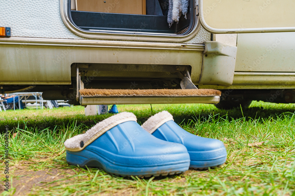 Obraz na plátně Shoes clogs in front of camper car step
