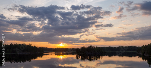 summer sunset panorama over forest lake