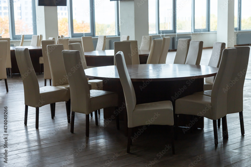 Abstract modern interior of cafe or meeting room with rounded armchairs