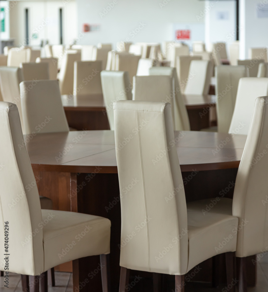 Abstract modern interior of cafe or meeting room with rounded armchairs