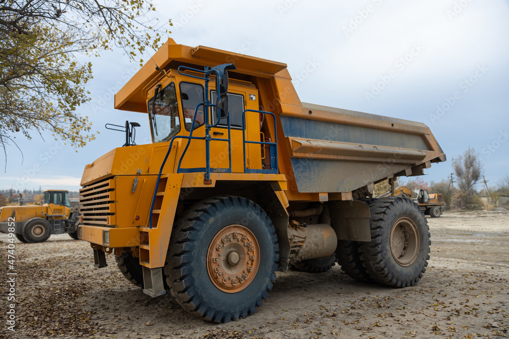 Large mining dump truck. Transport industry. Extraction of stone in an open pit