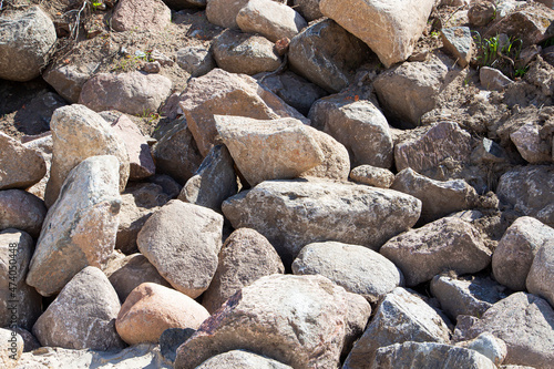 Rockfall on the road in the mountains. Stones of different sizes. Landslides.