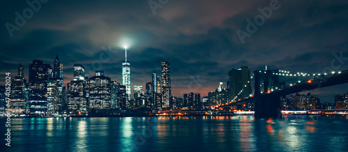 Panoramic view of New York with Brooklyn bridge by night