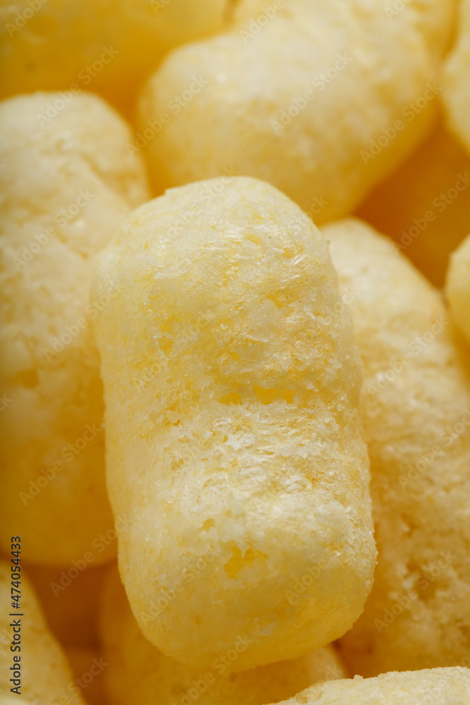 Yellow dessert Corn sticks in powdered sugar texture.