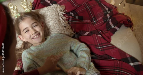 Happy little children playing at home on Christmas eve