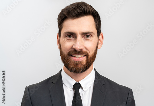 Portrait of charming adult businessman true boss feeling content emotions while posing isolated over white color background