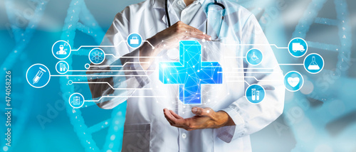 Doctor holding the icon of the more as a concept of health, medical insurance and personal status.