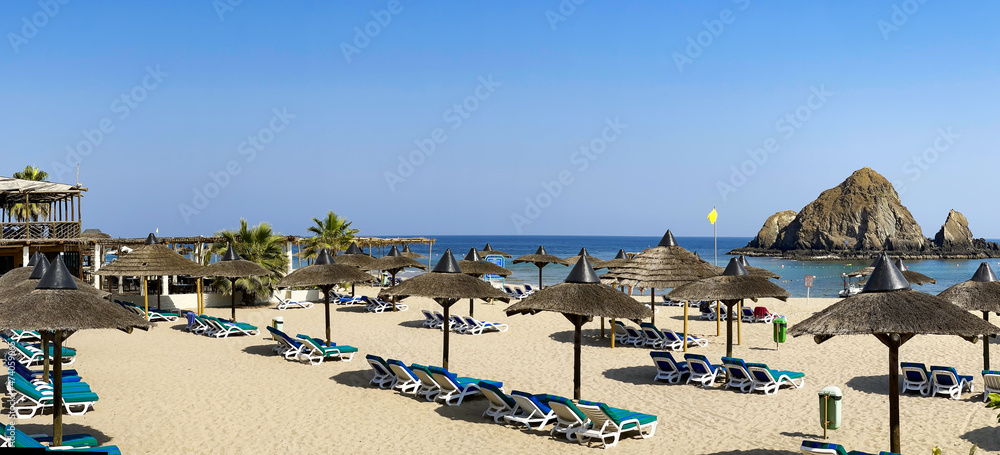 Panorama of white sand beach on the shores of the Indian Ocean in Dibba, Al Fujairah, United Arab Emirates