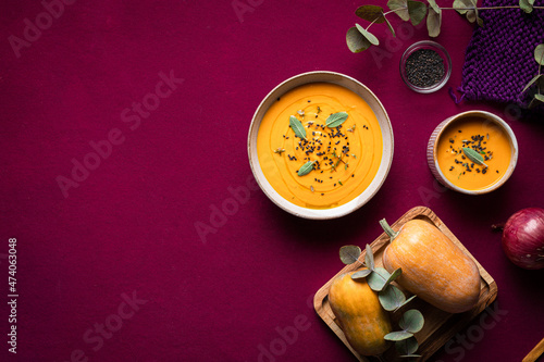 Tasty pumpkin soup placed on a plate on a table on a tabletop