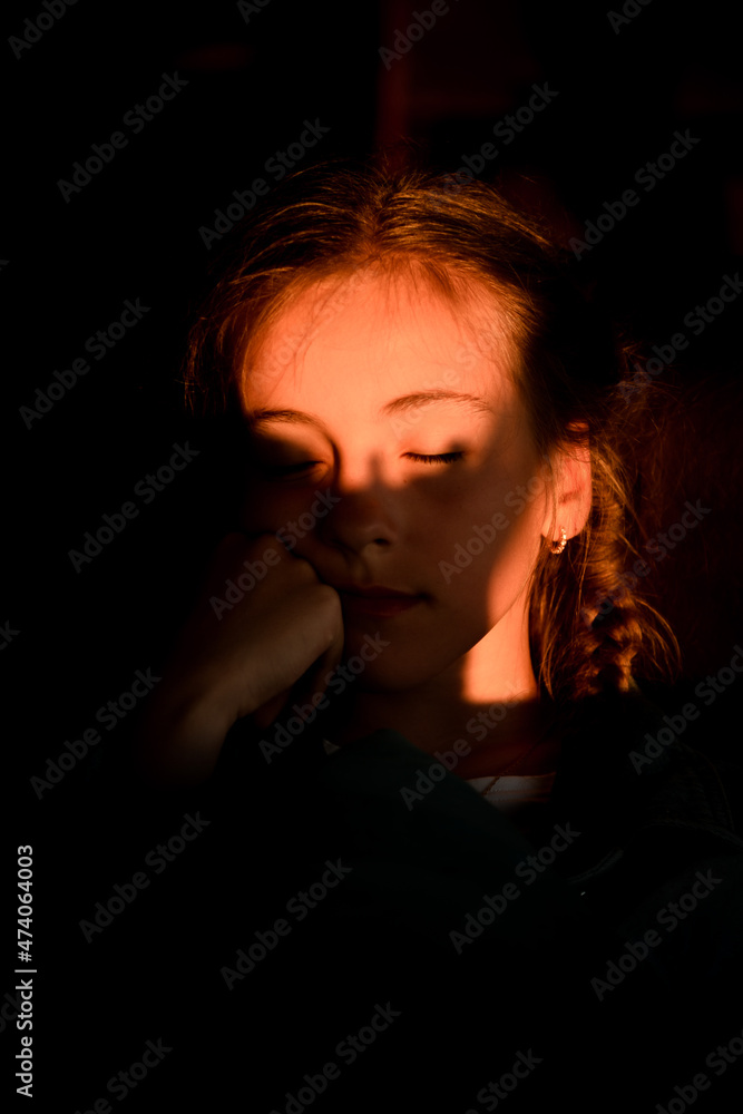 A beautiful girl in the rays of the setting sun. Summer. Shadows. Light. A beautiful girl in the rays of the setting sun. Summer. Shadows. Light.