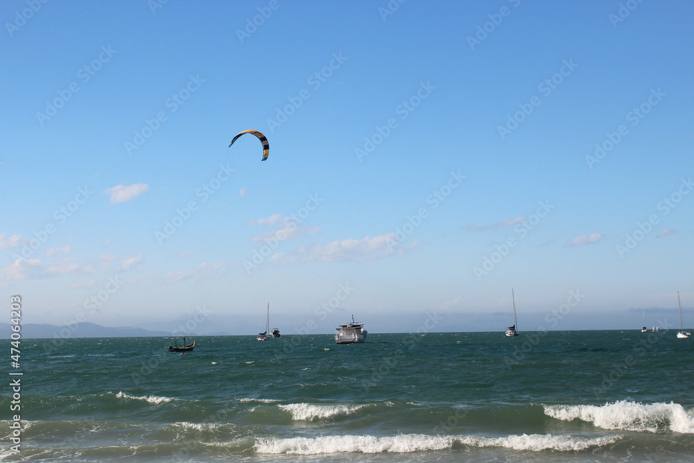 Kitesurf and boats in Jurere Beach, Florianopolis, Santa Catarina, Brazil.