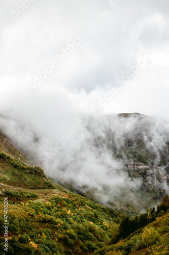Peaks of Mount Aibga in autumn clouds