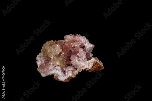 Macro mineral stone Pink Amethyst on a black background