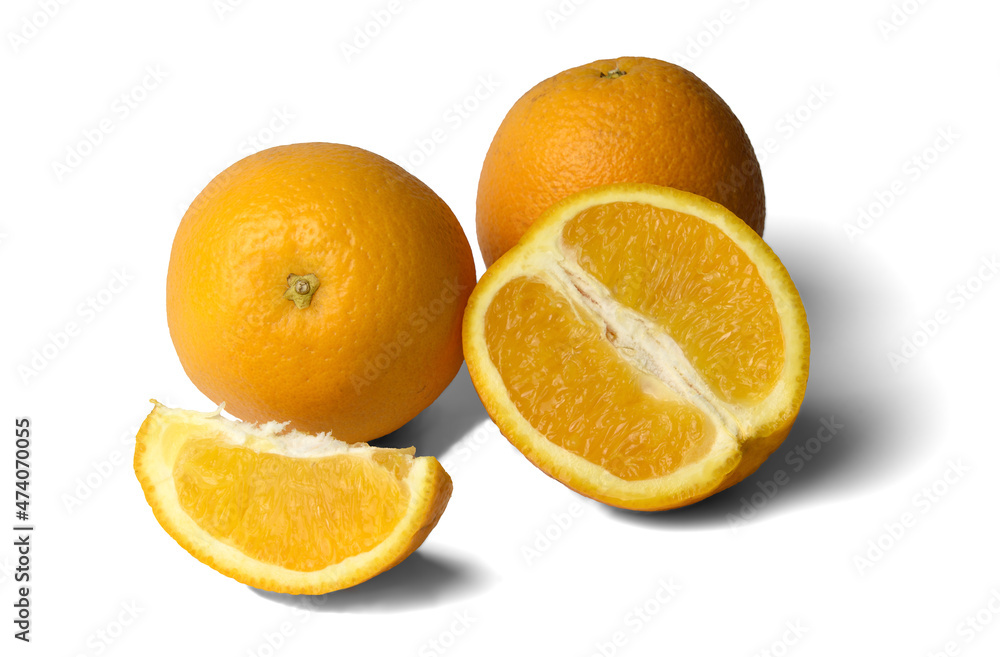 two whole oranges and orange slices on a white background, close-up, isolate
