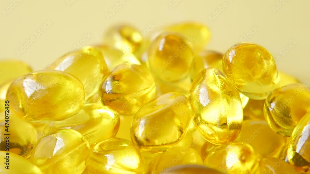 fish oil supplement on orange background fish oil supplement on orange background