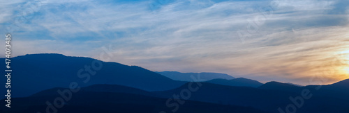 Mountains in a misty haze at sunset © alexmu