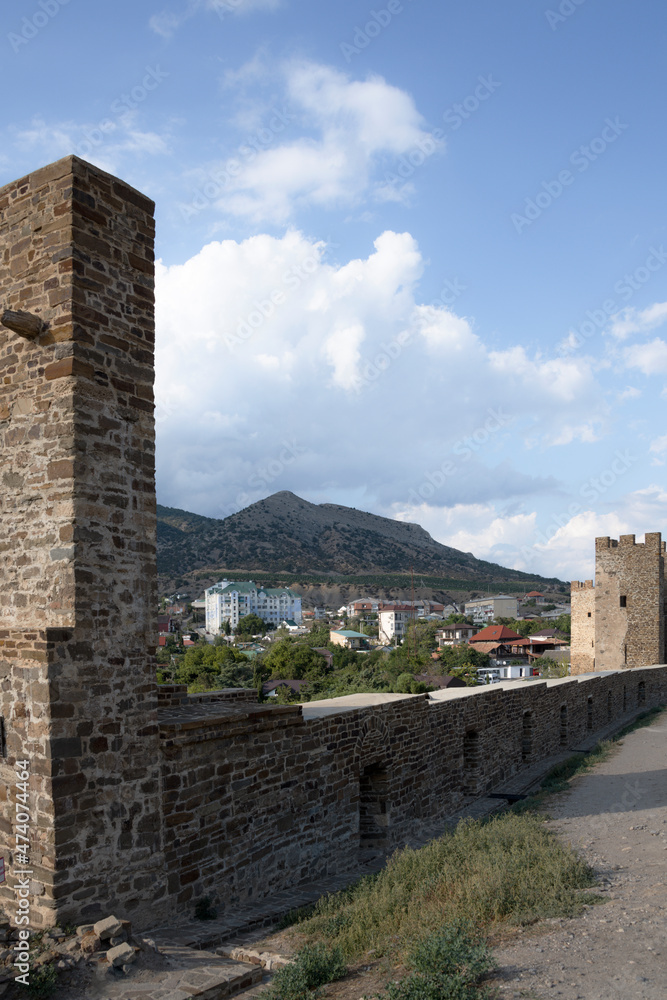 Obraz premium The Genoese fortress is a ancient fortress in the city of Sudak on the Crimean peninsula, built by the Genoese as a stronghold on the Black Sea. Tourism concept, travel, landmarks.