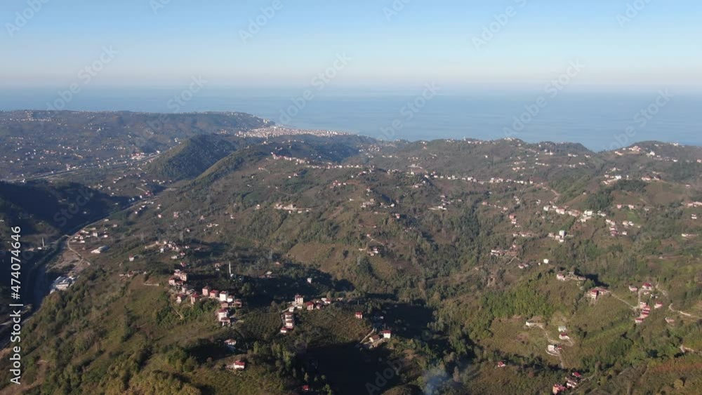 Aerial view of a village in the lush green rain cloud cover rain forest mountain during the rainy season in the northern Turkey Trabzon Aerial view of a village in the lush green rain cloud cover rain forest mountain during the rainy season in the northern Turkey Trabzon